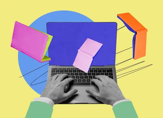 A person typing on a laptop with a notebook nearby, executing a plan for content marketing for law firms.